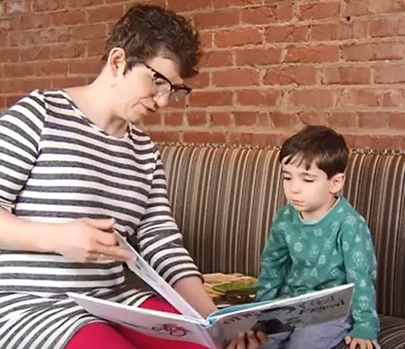 Woman reading to child